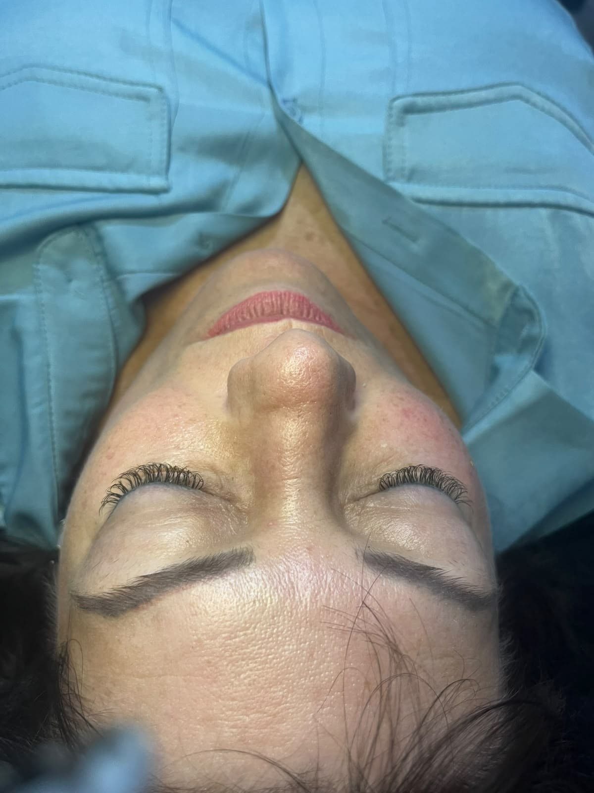 Lash lift and brow tint result with curled, defined lashes